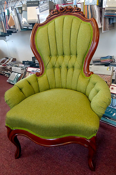 reupholstered green chair